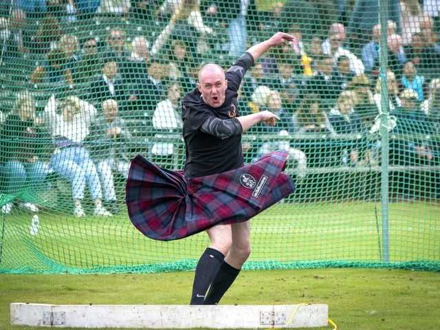 A participant competes in the weight throw during the Braemar Royal Highland Gathering