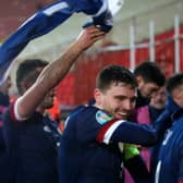 BELGRADE, SERBIA - NOVEMBER 12: Andy Robertson of Scotland celebrates with his team after his teams victory in the UEFA EURO 2020 Play-Off Final between Serbia and Scotland at Rajko Mitic Stadium on November 12, 2020 in Belgrade, Serbia. Football Stadiums around Europe remain empty due to the Coronavirus Pandemic as Government social distancing laws prohibit fans inside venues resulting in fixtures being played behind closed doors. (Photo by Srdjan Stevanovic/Getty Images)