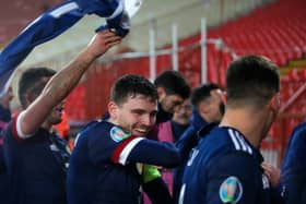 BELGRADE, SERBIA - NOVEMBER 12: Andy Robertson of Scotland celebrates with his team after his teams victory in the UEFA EURO 2020 Play-Off Final between Serbia and Scotland at Rajko Mitic Stadium on November 12, 2020 in Belgrade, Serbia. Football Stadiums around Europe remain empty due to the Coronavirus Pandemic as Government social distancing laws prohibit fans inside venues resulting in fixtures being played behind closed doors. (Photo by Srdjan Stevanovic/Getty Images)