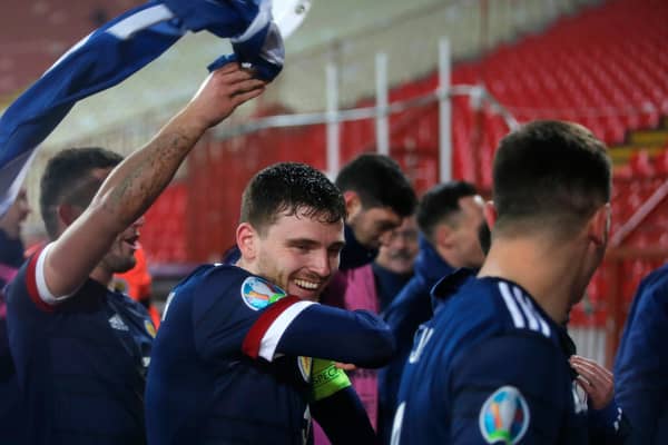 BELGRADE, SERBIA - NOVEMBER 12: Andy Robertson of Scotland celebrates with his team after his teams victory in the UEFA EURO 2020 Play-Off Final between Serbia and Scotland at Rajko Mitic Stadium on November 12, 2020 in Belgrade, Serbia. Football Stadiums around Europe remain empty due to the Coronavirus Pandemic as Government social distancing laws prohibit fans inside venues resulting in fixtures being played behind closed doors. (Photo by Srdjan Stevanovic/Getty Images)
