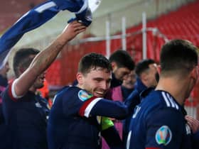BELGRADE, SERBIA - NOVEMBER 12: Andy Robertson of Scotland celebrates with his team after his teams victory in the UEFA EURO 2020 Play-Off Final between Serbia and Scotland at Rajko Mitic Stadium on November 12, 2020 in Belgrade, Serbia. Football Stadiums around Europe remain empty due to the Coronavirus Pandemic as Government social distancing laws prohibit fans inside venues resulting in fixtures being played behind closed doors. (Photo by Srdjan Stevanovic/Getty Images)