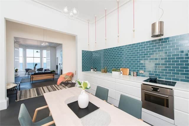 The kitchen and living room have been opened up to create light filled space.