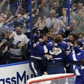 The Tampa Bay Lightning celebrate their series win over the Montreal Canadiens to retain the Stanley Cup in the NHL ice hockey finals. Picture: Gerry Broome/AP