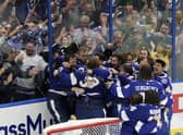 The Tampa Bay Lightning celebrate their series win over the Montreal Canadiens to retain the Stanley Cup in the NHL ice hockey finals. Picture: Gerry Broome/AP