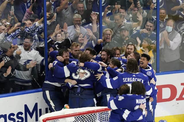 The Tampa Bay Lightning celebrate their series win over the Montreal Canadiens to retain the Stanley Cup in the NHL ice hockey finals. Picture: Gerry Broome/AP