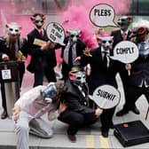 Extinction Rebellion wear rat masks as they protest outside the Department of Business, Energy, Industrial Strategy in central London (Picture: Tolga Akmen/AFP via Getty Images)