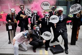Extinction Rebellion wear rat masks as they protest outside the Department of Business, Energy, Industrial Strategy in central London (Picture: Tolga Akmen/AFP via Getty Images)