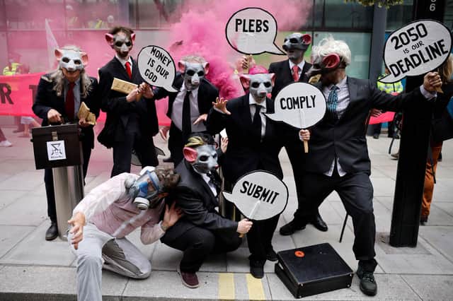 Extinction Rebellion wear rat masks as they protest outside the Department of Business, Energy, Industrial Strategy in central London (Picture: Tolga Akmen/AFP via Getty Images)