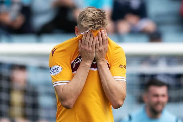 Motherwell debutant Juhani Ojala looks dejected as the Fir Park side lose to Dundee in the Premier Sports Cup. Picture: SNS