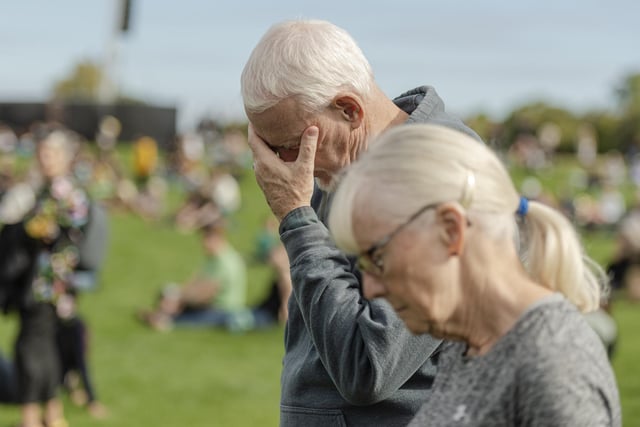 Members of the public pay their respects to Her Majesty