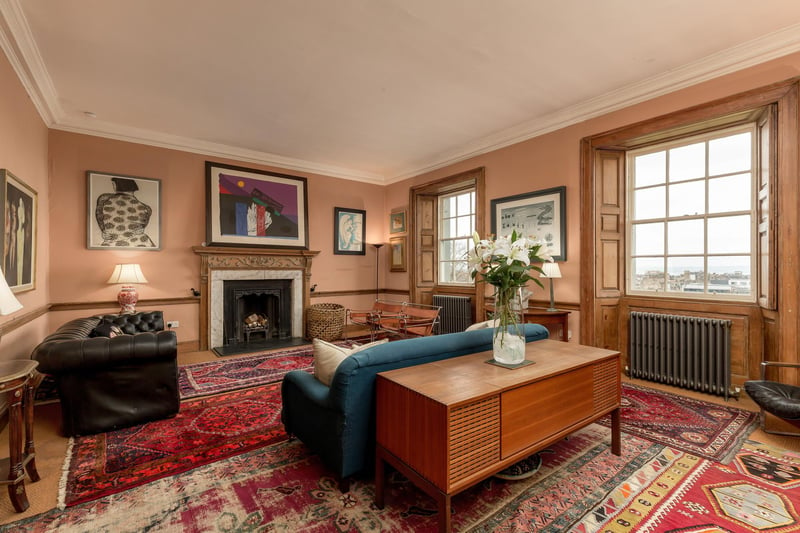 Interior: The home is packed with original period features and comprises a sitting room and library/ third bedroom on the ground floor,
two bedrooms and kitchen with French doors on the garden level, and a fourth bedroom, additional sitting room, and study on the third.
