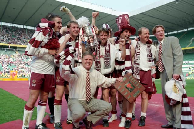 Hearts manager Jim Jefferies and players celebrate winning the 1998 Scottish Cup after a 2-1 win over Rangers at Celtic Park.