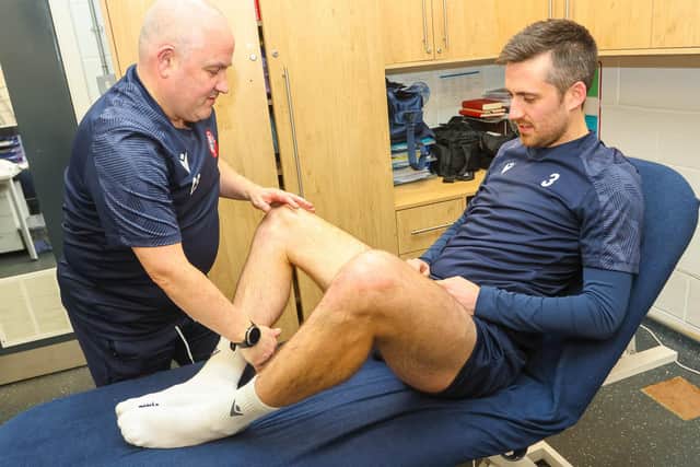 Spartans new signing, former Hibsand St Johnstone left-back Callum Booth, receives treatment from club physio Craig Samuel.