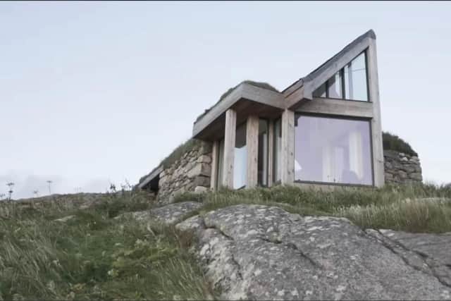 Taigh Bainne: the modern bothy carved out of an old stone, dairy ruin on the rocky, windswept west coast of Eriskay
