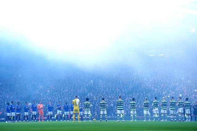 Rangers and Celtic players take part in a minute's applause. The build-up to the Scottish League Cup final has been marred by fighting between the fans of both clubs. Picture: Jane Barlow/PA Wire
