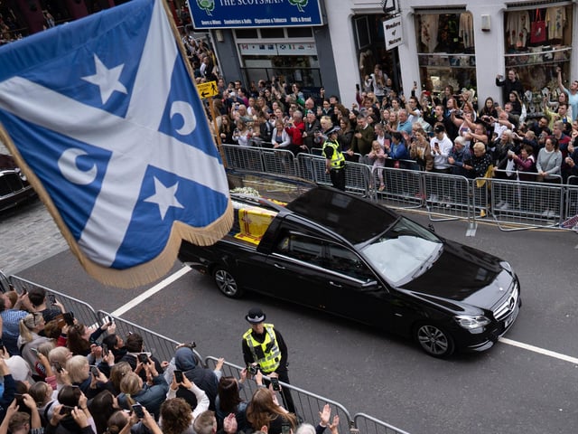 The Queens coffin travels down the Royal Mile in Edinburgh