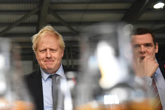 Prime Minister Boris Johnson was urged to resign if he'd lied by Douglas Ross