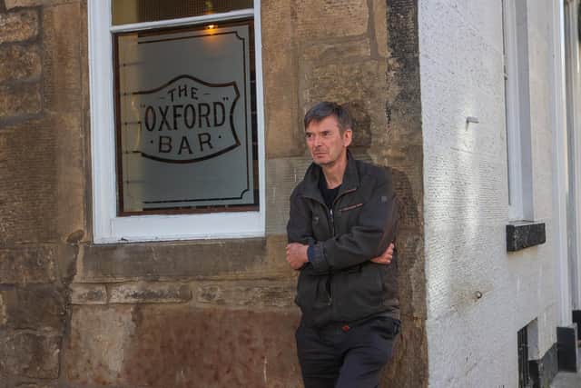 Author Ian Rankin outside The Oxford Bar.