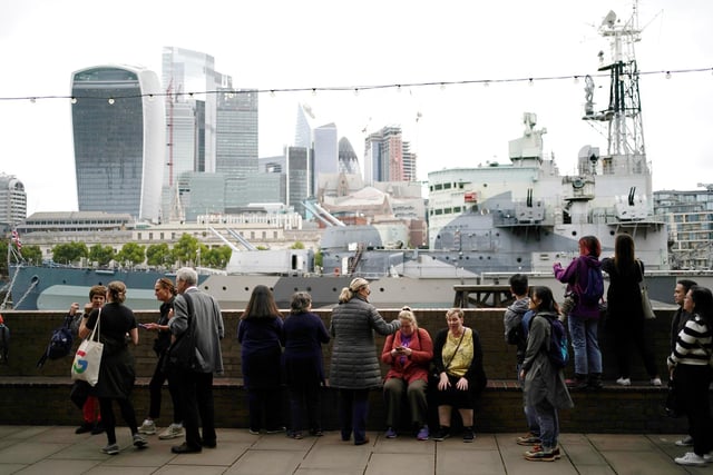 Members of the public in the queue on the South Bank near to HMS Belfast, London, as they wait to view Queen Elizabeth II lying in state ahead of her funeral on Monday. Picture date: Thursday September 15, 2022.