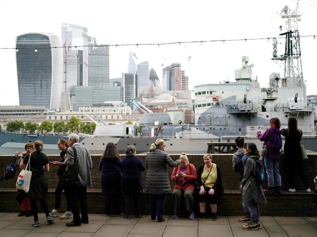 Members of the public in the queue on the South Bank near to HMS Belfast, London, as they wait to view Queen Elizabeth II lying in state ahead of her funeral on Monday. Picture date: Thursday September 15, 2022.