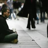 A homeless man begs for small change on the streets. Photo: Getty Images