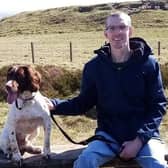 Andrew Moss and his dog near his home in Fife