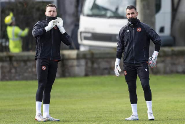 Goodwin will make a big call in goal between Jack Newman (L) and Mark Birighitti.