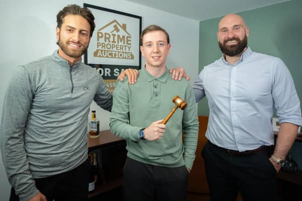 Hammering it: Myles Eddy with Luis Guarin (l) and John Morris.