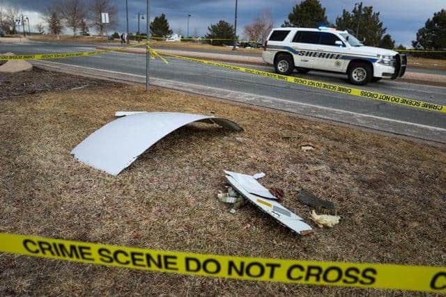Fragments of a Boeing 777 engine sit scattered in a Denver neighbourhood after catching fire mid-air. An engine on the Boeing 777 exploded after takeoff prompting the flight to return to Denver International Airport where it landed safely. (Pic: Getty Images)