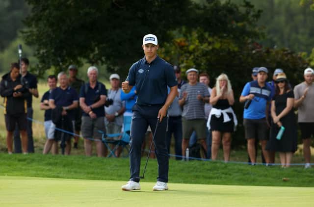 Calum Hill of Scotland reacts after a par putt on the 17th green in the final round of the Cazoo Classic at the London Golf Club. Picture: Andrew Redington/Getty Images.