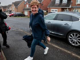 Nicola Sturgeon smiles as she arrives at her home following her resignation as Scotland’s First Minister (Picture: Jeff J Mitchell/Getty Images)