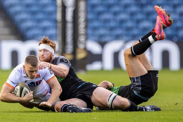 Mark Bennett is collared by his old Glasgow Warriors team-mate Rob Harley during an inter-city derby in 2020 at BT Murrayfield. (Photo by Craig Williamson / SNS Group)