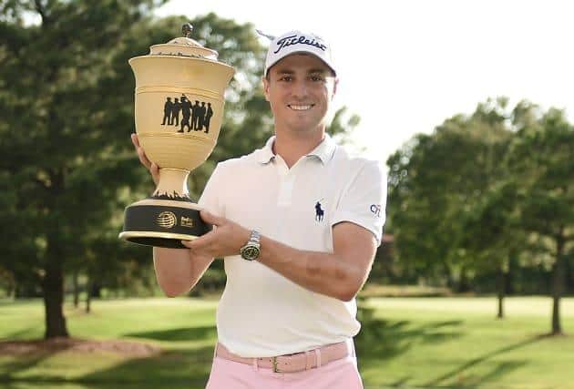 Justin Thomas shows off the WGC FedEx St Jude Invitational trophy after claiming his second win in the event. Picture: Getty Images