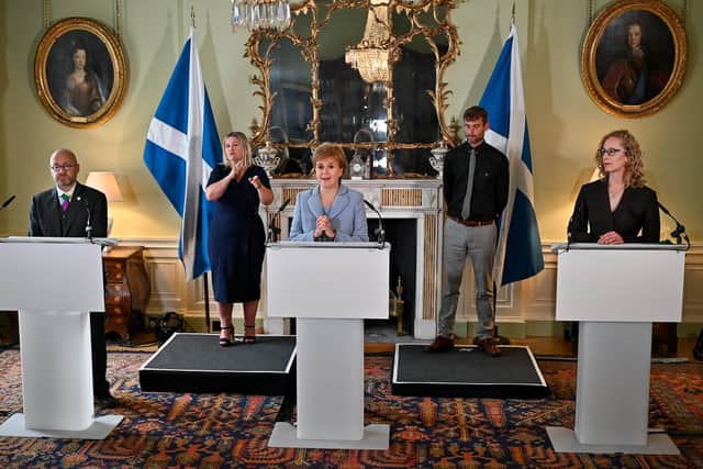 First Minister Nicola Sturgeon (centre) holds a media briefing with Scottish Greens co-leaders Patrick Harvie (left) and Lorna Slater (right) at Bute House. Picture: Jeff J Mitchell - Pool / Getty Images