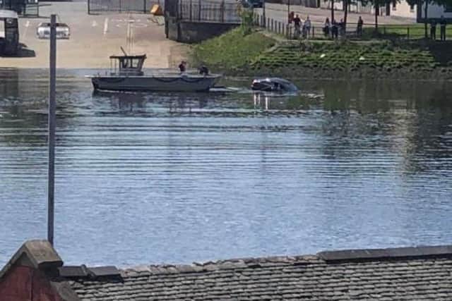 A woman was rescued by the skipper of the Renfrew Ferry from her car after she drove into the river.