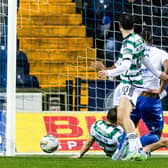 Celtic's Alistair Johnston makes a block on the line to deny Kilmarnock's Corrie Ndaba.