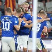 Chris Kane (left) celebrates with his teammates after Jason Kerr (middle) gave St Johnstone the lead against Galatasaray from the penalty spot  (Photo by Tolga Adanali / SNS Group)