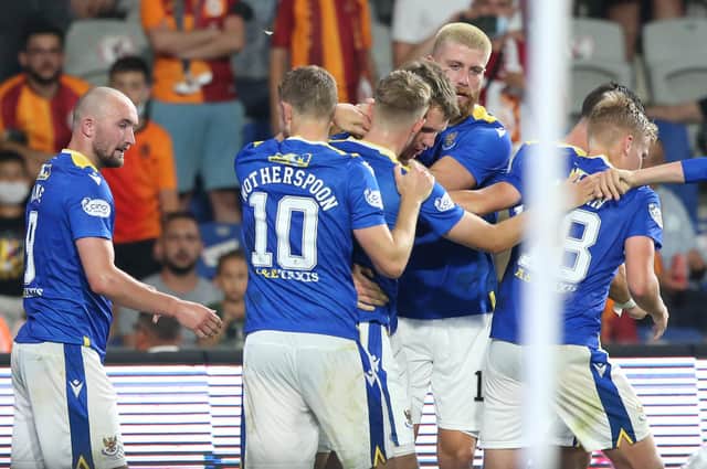 Chris Kane (left) celebrates with his teammates after Jason Kerr (middle) gave St Johnstone the lead against Galatasaray from the penalty spot (Photo by Tolga Adanali / SNS Group)