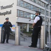 Police officers outside St Thomas' Hospital in Central London where Prime Minister Boris Johnson is in intensive care