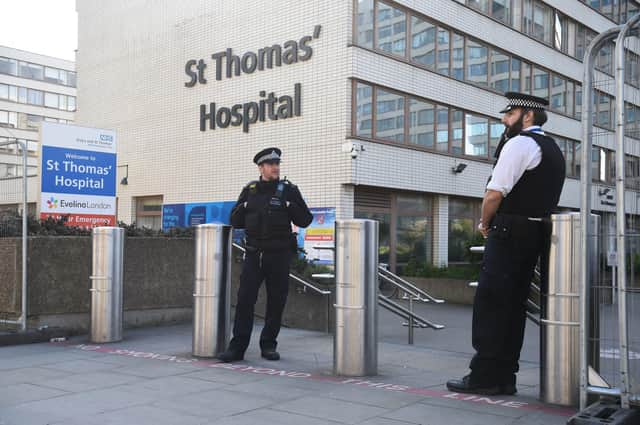Police officers outside St Thomas' Hospital in Central London where Prime Minister Boris Johnson is in intensive care