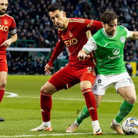 Hibs left-back Lewis Stevenson challenges Aberdeen's Bojan Miovski during the 2-0 win at Easter Road on Sunday. (Photo by Ross Parker / SNS Group)