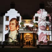 A portrait of Robert Burns is projected onto the front of Prestonfield House in Edinburgh (Picture: Jane Barlow/PA)