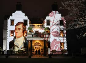 A portrait of Robert Burns is projected onto the front of Prestonfield House in Edinburgh (Picture: Jane Barlow/PA)