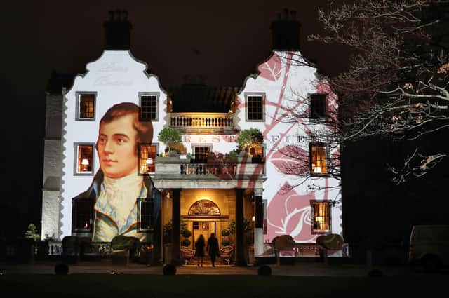 A portrait of Robert Burns is projected onto the front of Prestonfield House in Edinburgh (Picture: Jane Barlow/PA)