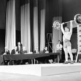 Phil Caira (Scotland) performs in a weightlifting contest at Leith Town Hall in Edinburgh.