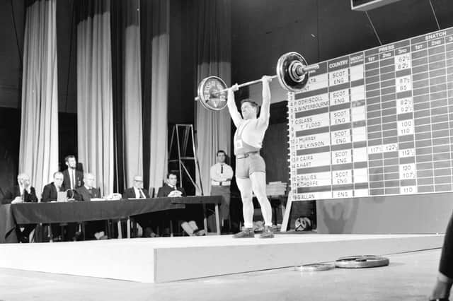 Phil Caira (Scotland) performs in a weightlifting contest at Leith Town Hall in Edinburgh.