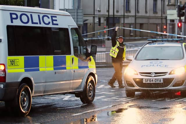 A police presence at Green Street in Kilmarnock, where officers continue to investigate what Police Scotland describe as a "serious incident" in the grounds of a local hospital and another location in the area. Picture date: Friday February 5, 2021. PA Photo. Police said the incidents are not being treated as terrorist-related but are potentially linked. See PA story POLICE Hospital. Photo credit should read: Jane Barlow/PA Wire