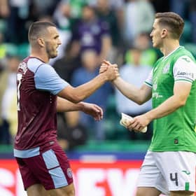 Hibs defender Paul Hanlon and Aston Villa midfielder John McGinn at full-time following the first leg at Easter Road. (Photo by Ross Parker / SNS Group)