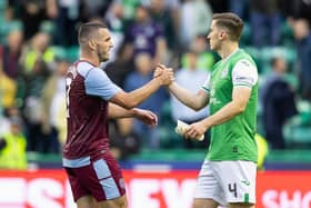 Hibs defender Paul Hanlon and Aston Villa midfielder John McGinn at full-time following the first leg at Easter Road. (Photo by Ross Parker / SNS Group)