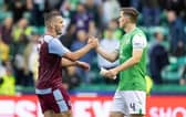 Hibs defender Paul Hanlon and Aston Villa midfielder John McGinn at full-time following the first leg at Easter Road. (Photo by Ross Parker / SNS Group)